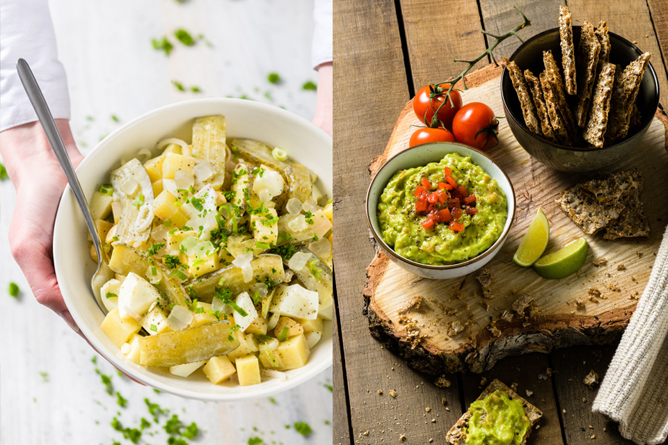 Aardappelsalade in mooi servies en guacamole van avocado met crackers